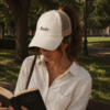 20260520222159-1f1549a5-1425-66d4-8d71-ee3270860f80.png Books Ponytail Trucker Hat | Bookish Embroidered Cap