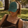 20260520222206-1f1549a5-5b38-6440-93de-6eb810b5ec1d.png Books Ponytail Trucker Hat | Bookish Embroidered Cap