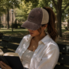 20260520222208-1f1549a5-7148-6ac8-a0b9-6e02f5c3f68a.png Books Ponytail Trucker Hat | Bookish Embroidered Cap